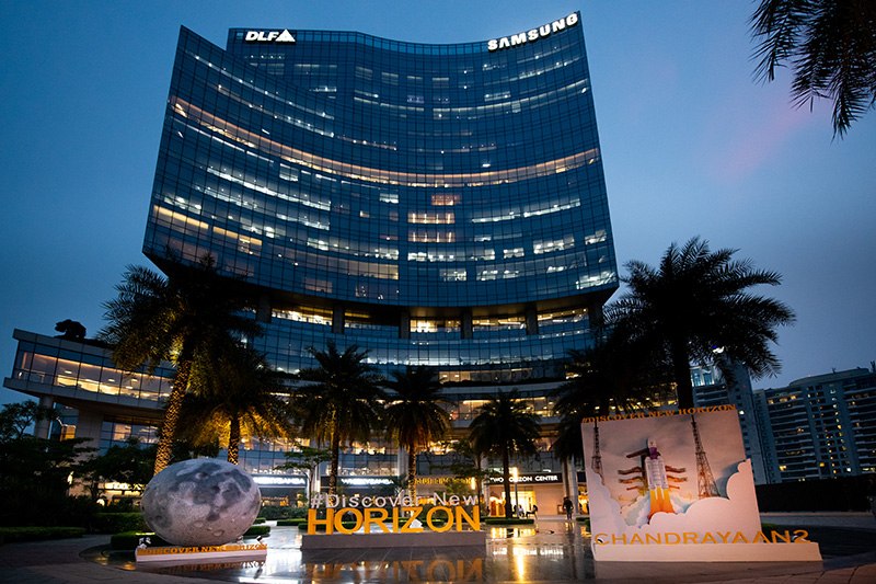 One Horizon Center building in DLF Phase 5, Gurgaon, lit up at dusk