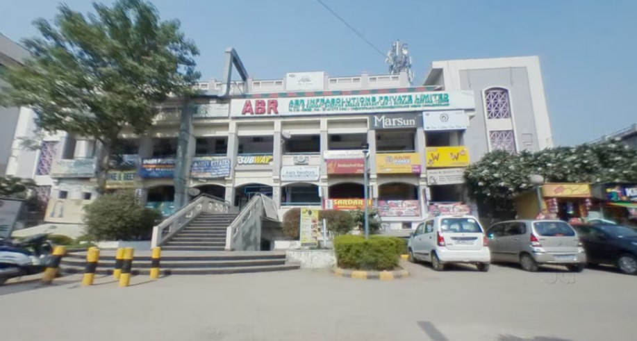 A local commercial market street with shops and offices in Sushant Lok 1, Gurgaon